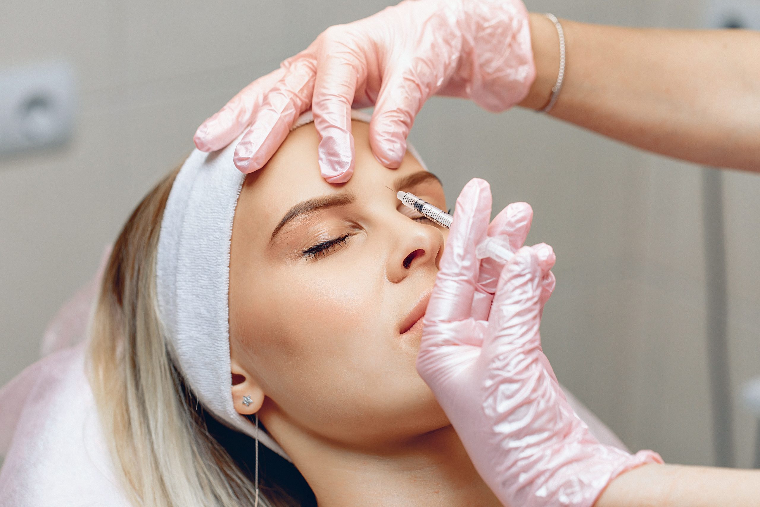 neat-master-beautician-who-injects-botox-brow-area-charming-patient-anti-aging-treatment-concept