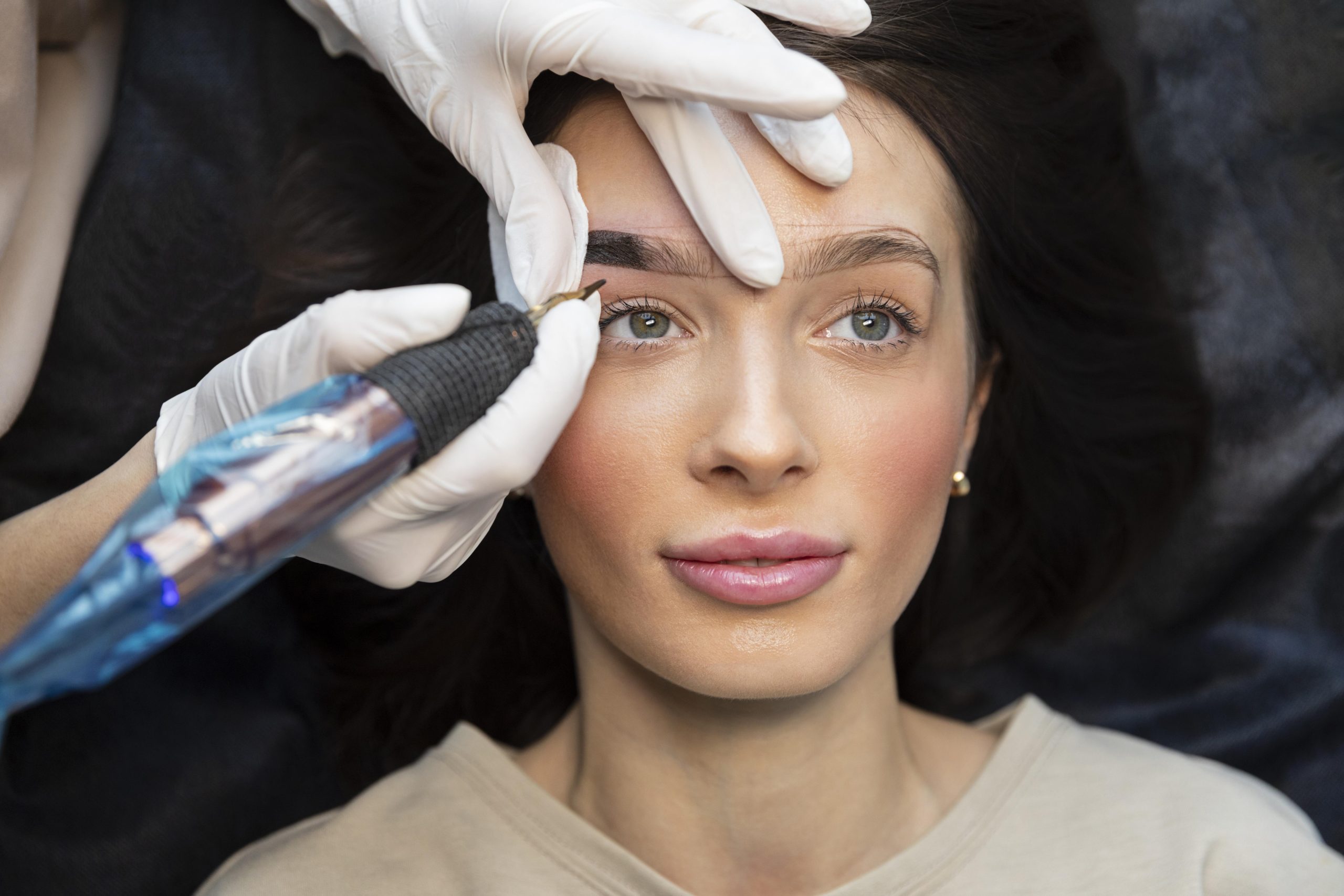 young-woman-getting-beauty-treatment-her-eyebrows